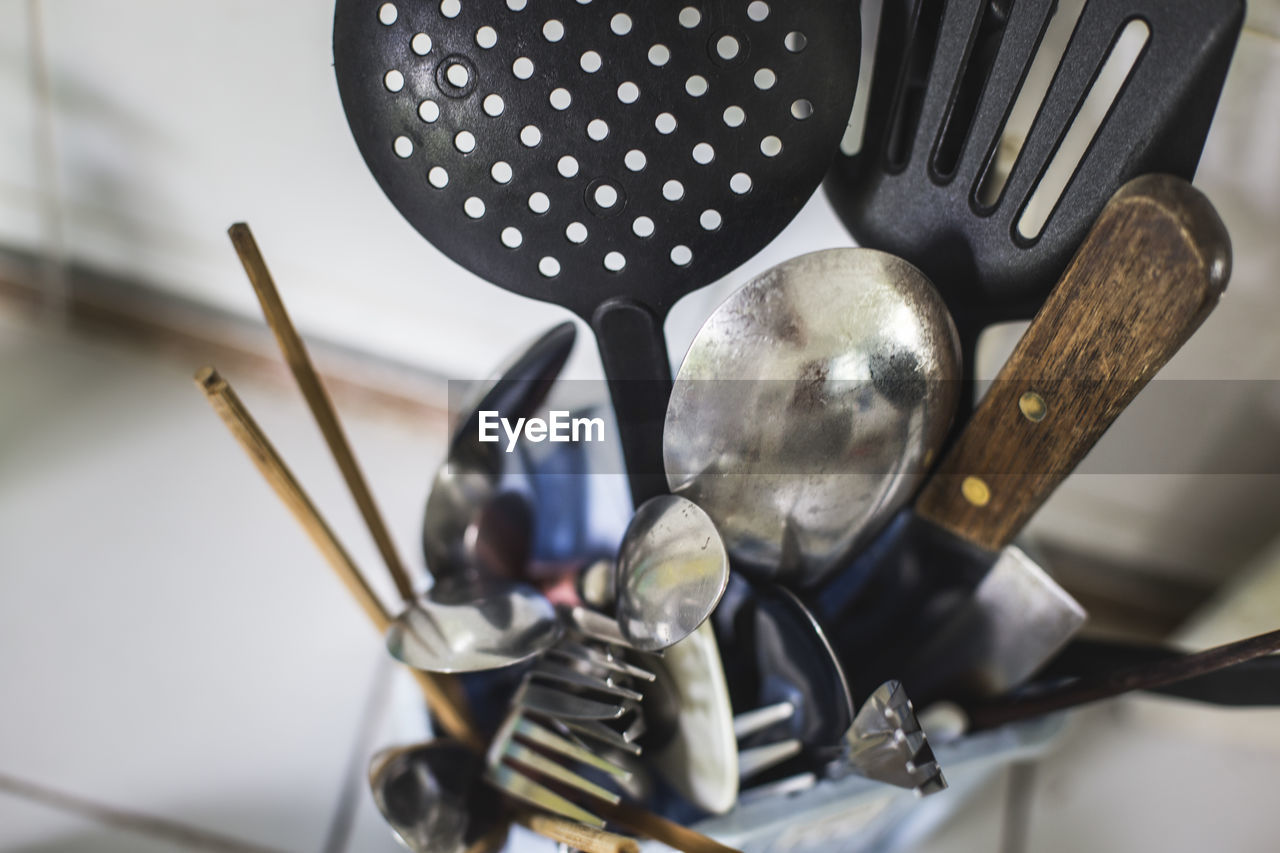 High angle view of various utensils in container at kitchen