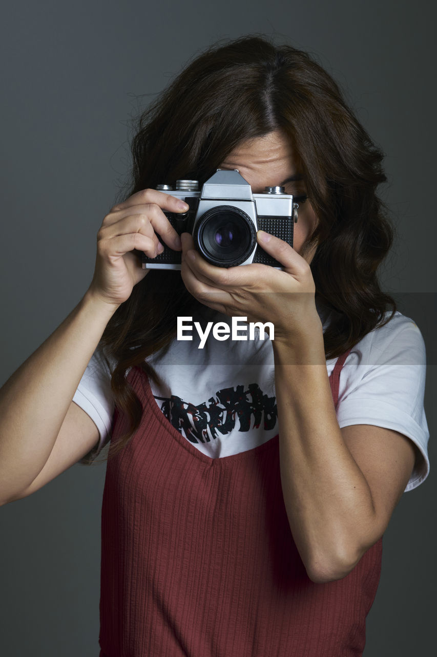 Person taking a photo in the studio