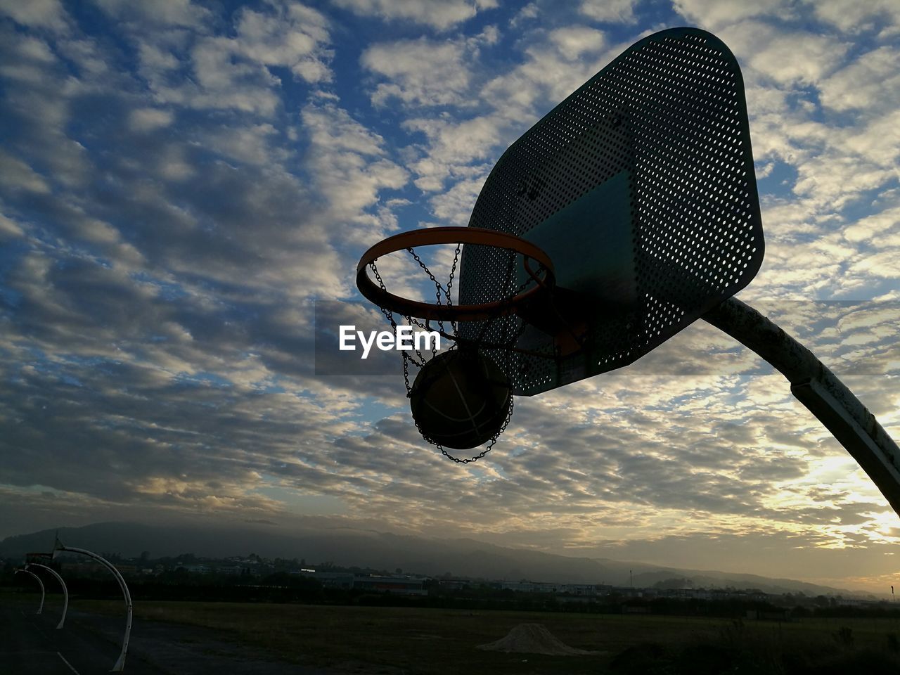 VIEW OF BASKETBALL HOOP AGAINST SKY