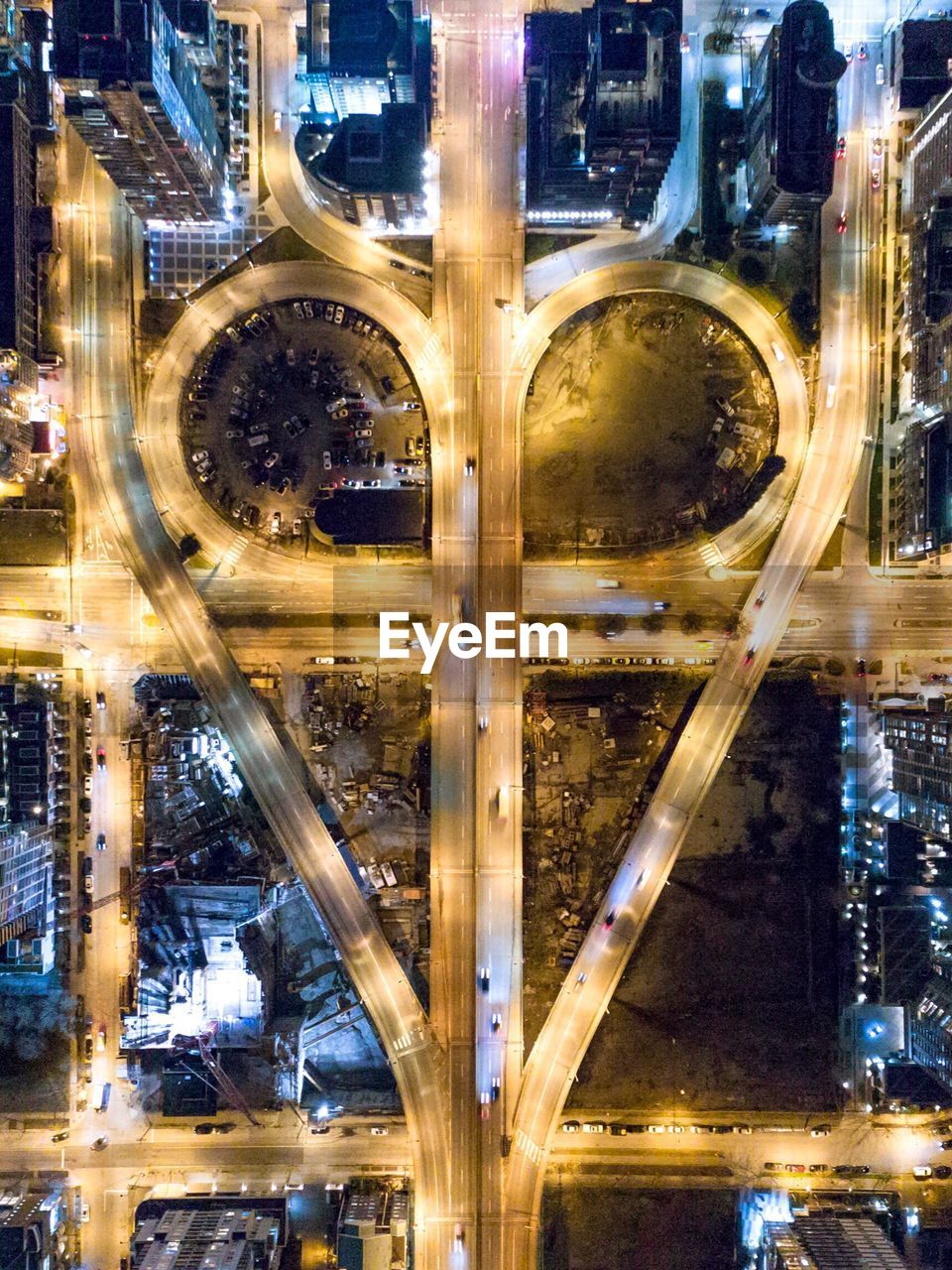 Directly above view of illuminated streets in city at night