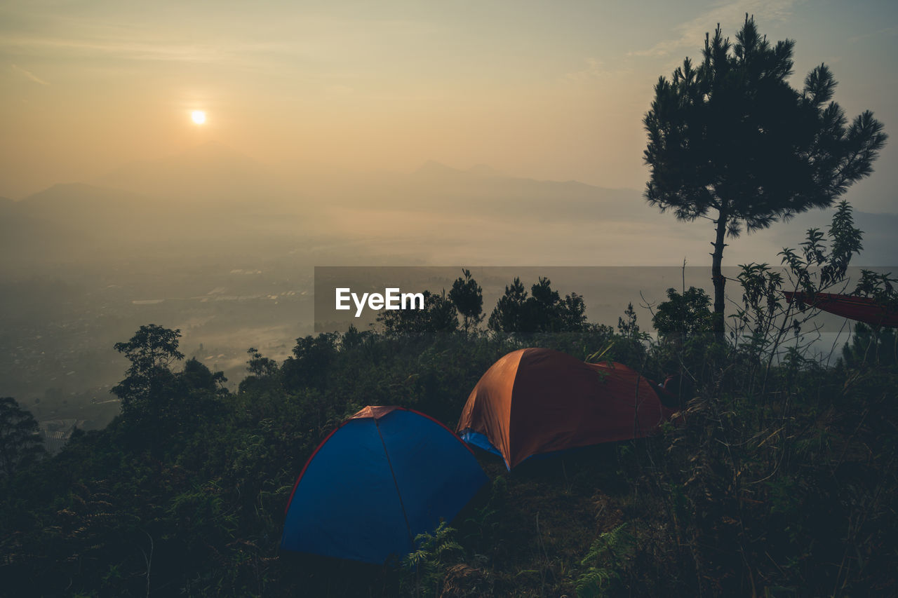 Tent against sky during sunset