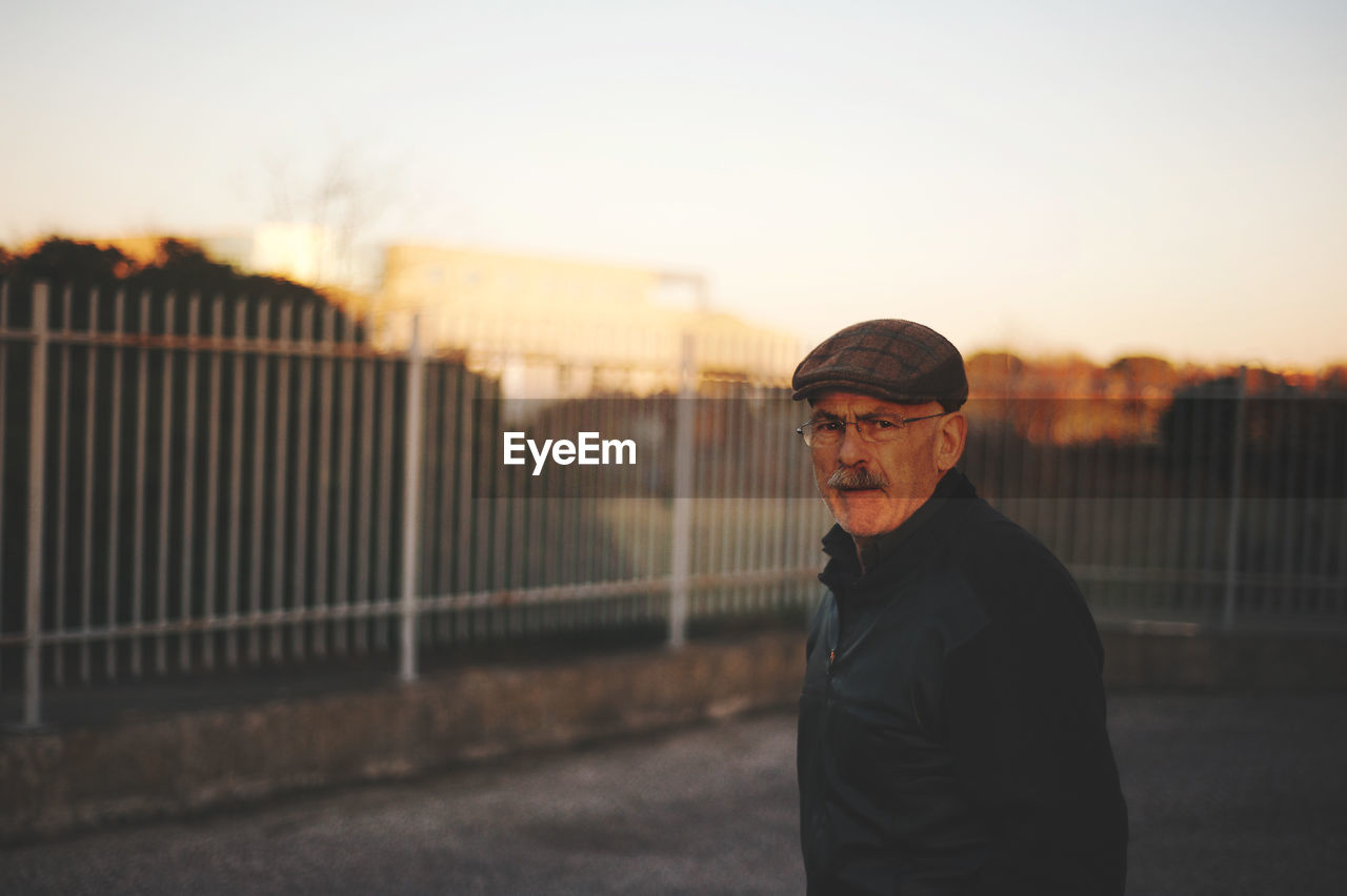 Portrait of man standing outdoors