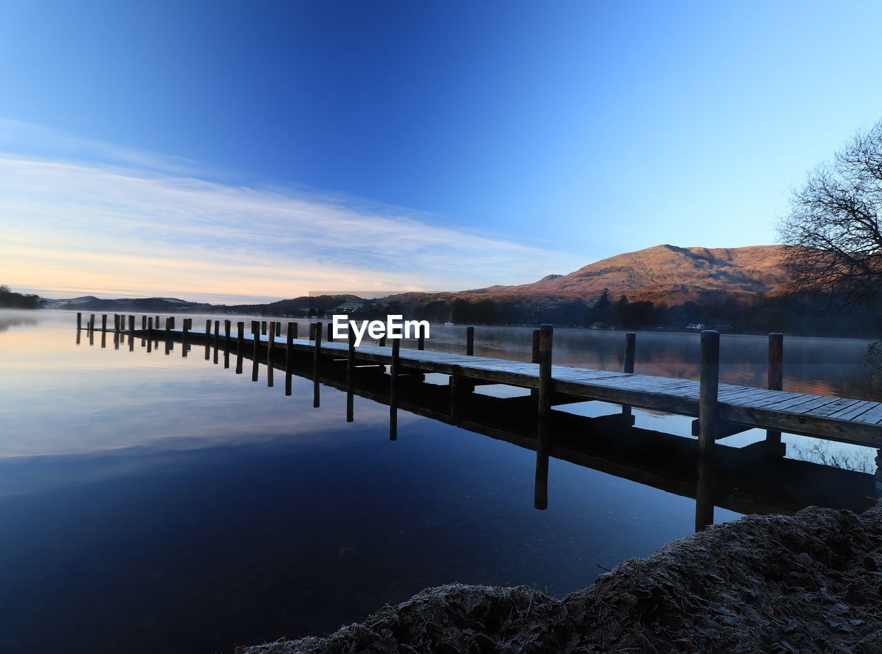 Scenic view of lake against blue sky