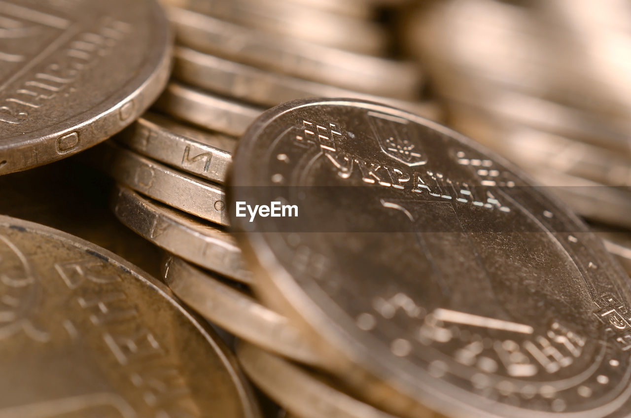 FULL FRAME SHOT OF COINS WITH SPOON