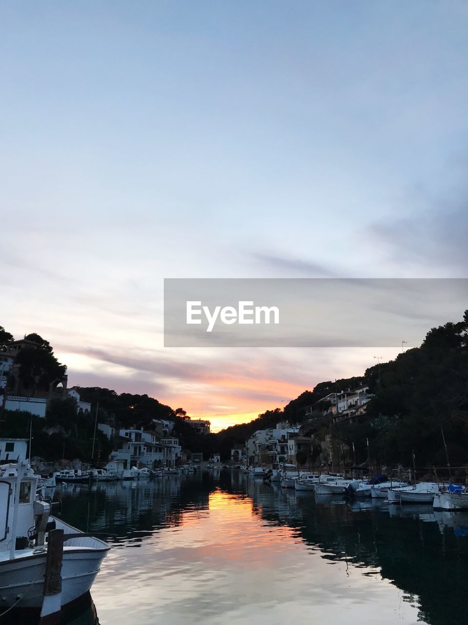 REFLECTION OF SKY IN LAKE DURING SUNSET