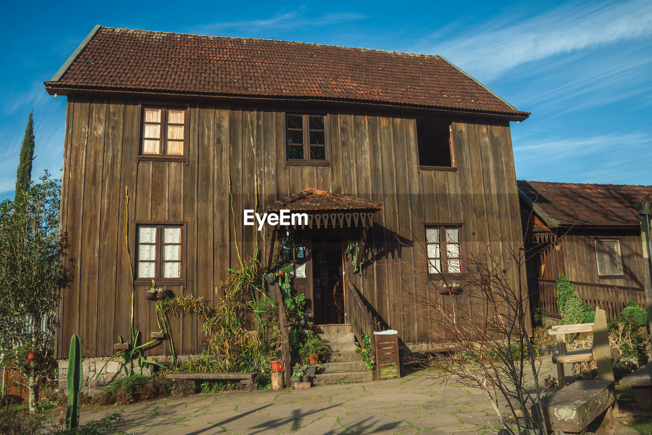 Entrance of charming wooden old house in a traditional rural style, near bento goncalves, brasil.