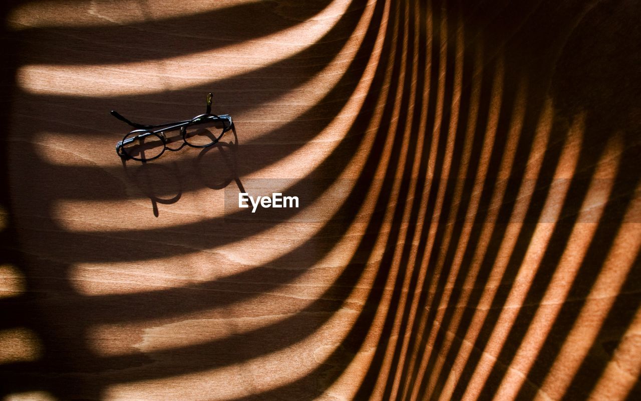 High angle view of a shadow on chair