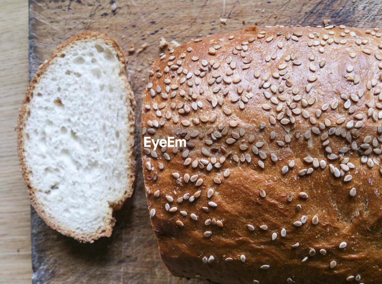 Close-up of bread on wooden chopping board