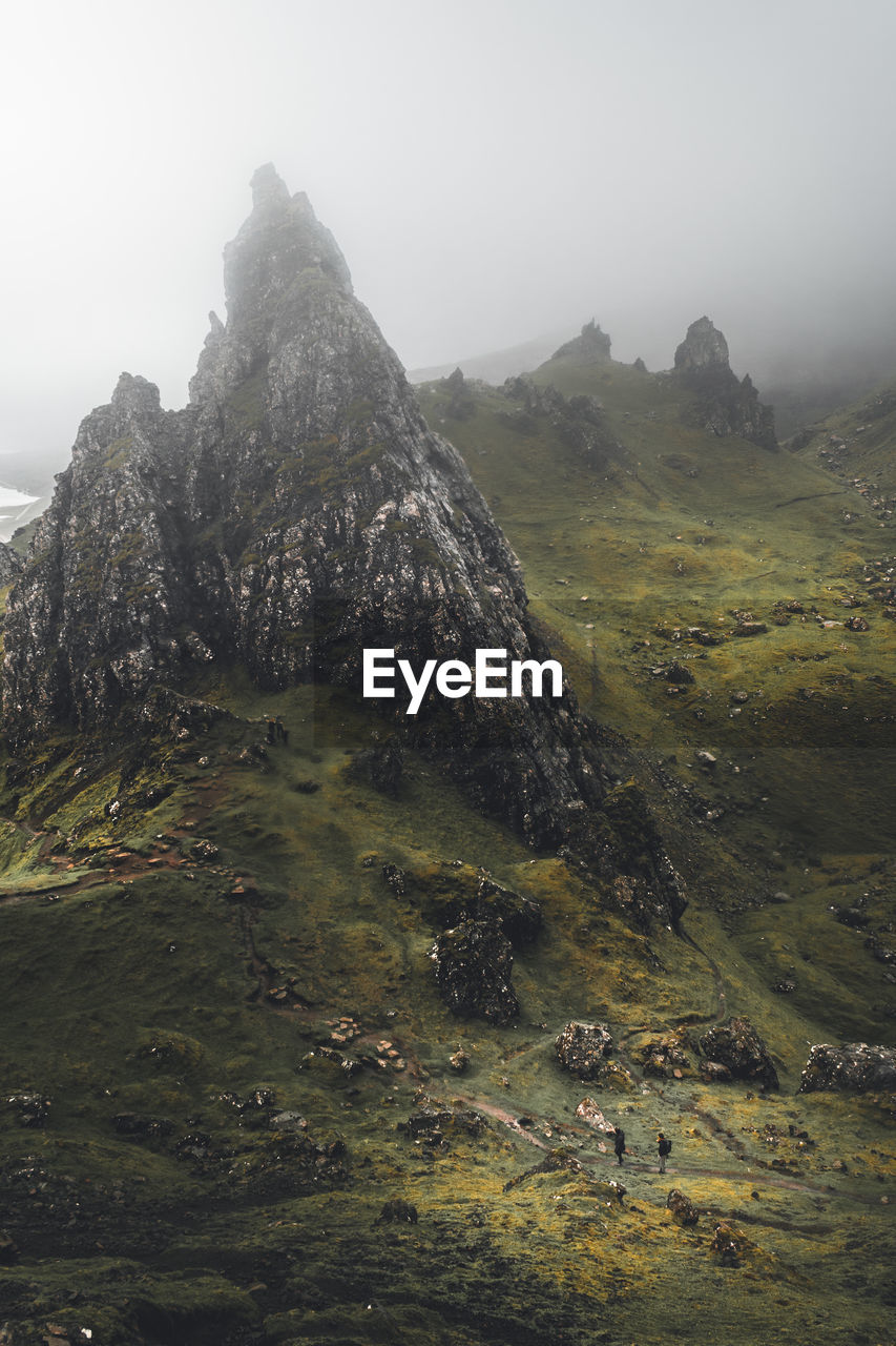 SCENIC VIEW OF LANDSCAPE AND MOUNTAINS AGAINST SKY