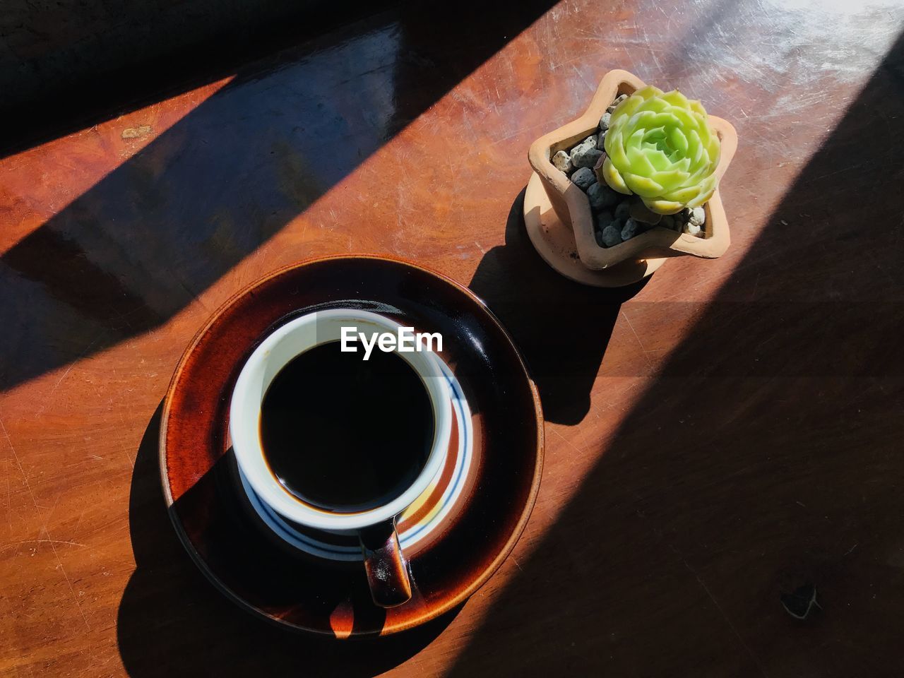 High angle view of black coffee on table