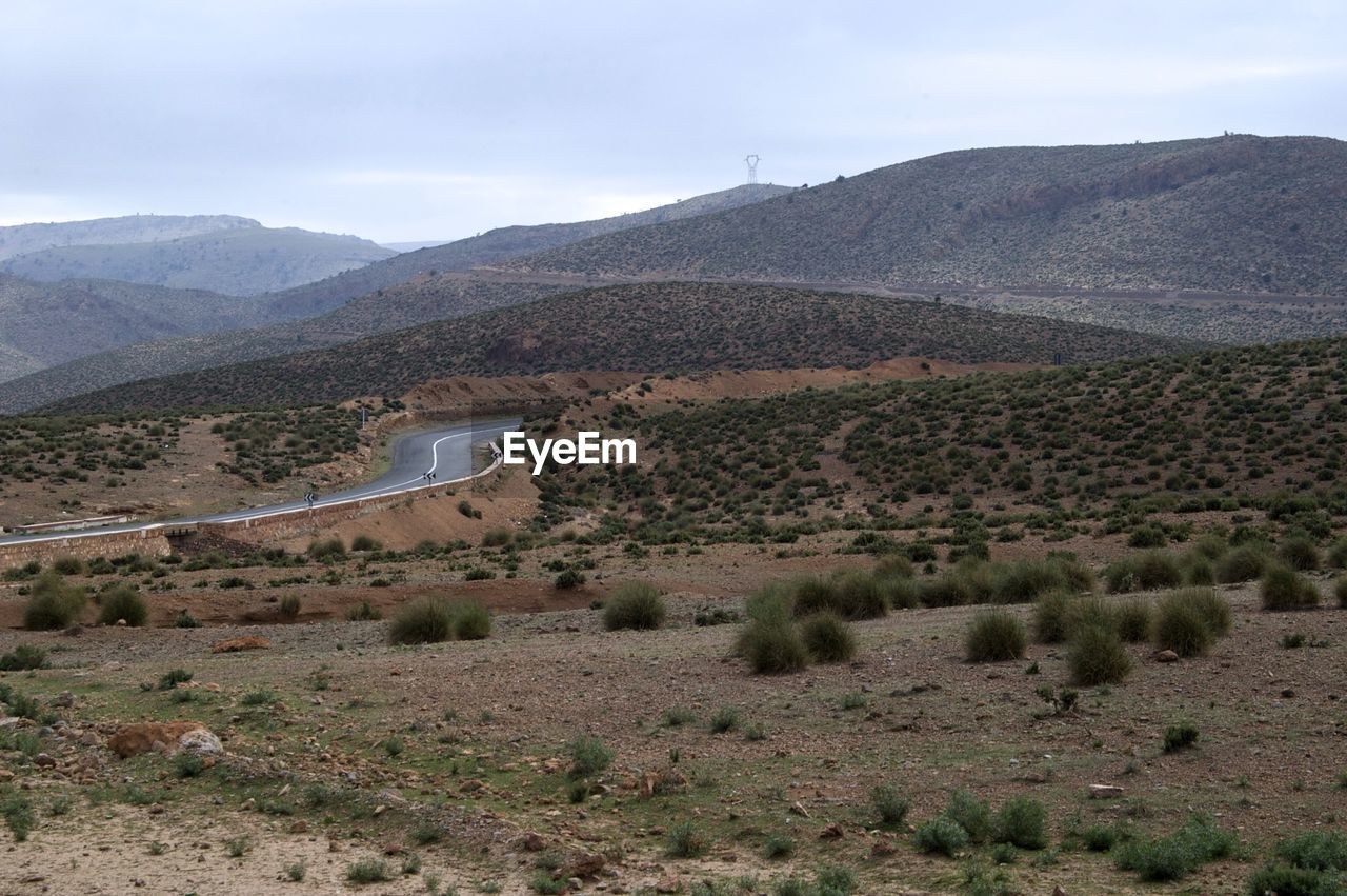 Scenic view of landscape and mountains against sky