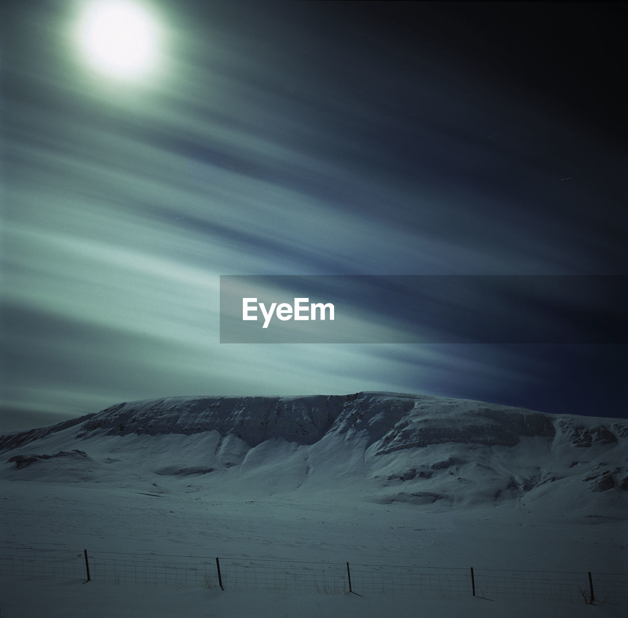 Moonrise over snowy landscape in the icelandic highlands