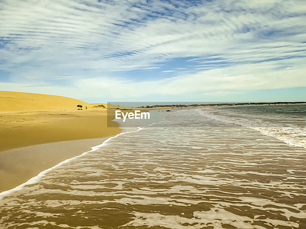 SCENIC VIEW OF SANDY BEACH AGAINST SKY