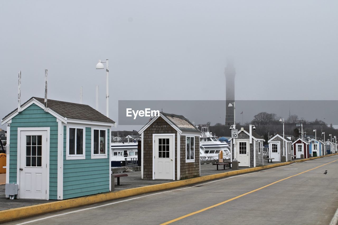 Wooden market shops along fishing pier in new england art colony