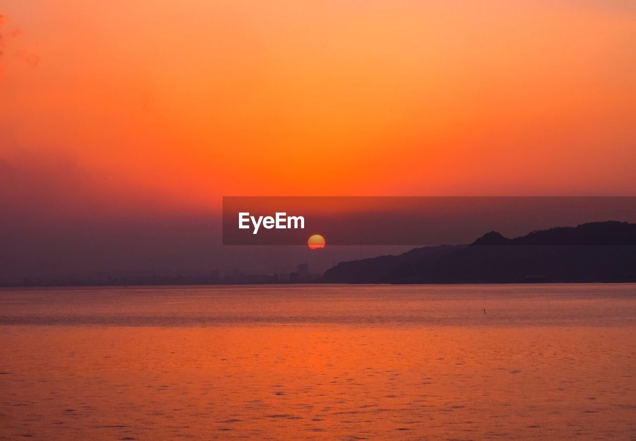 SCENIC VIEW OF SEA AGAINST ROMANTIC SKY