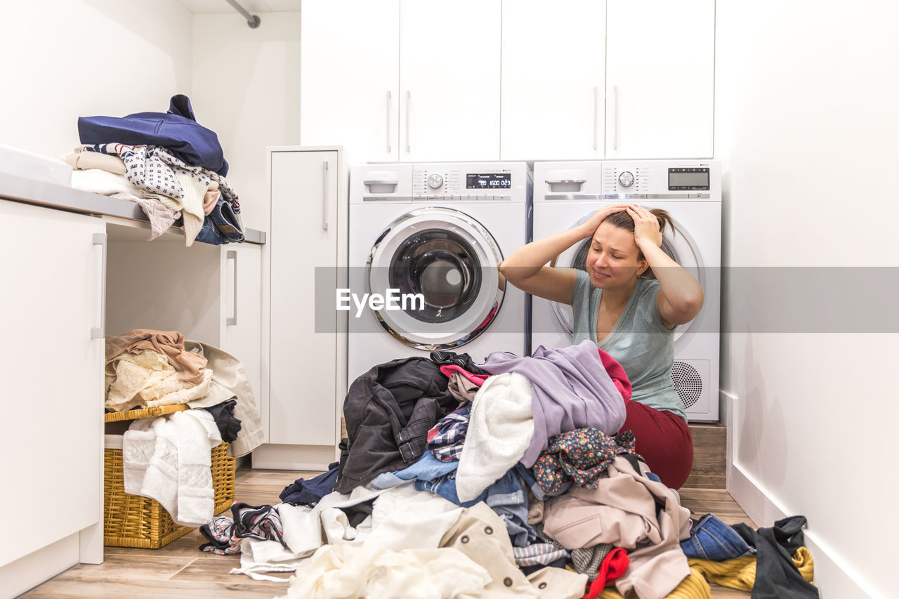 Frustrated woman at laundromat