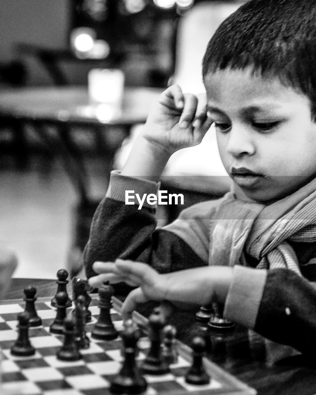 Boy playing chess at home