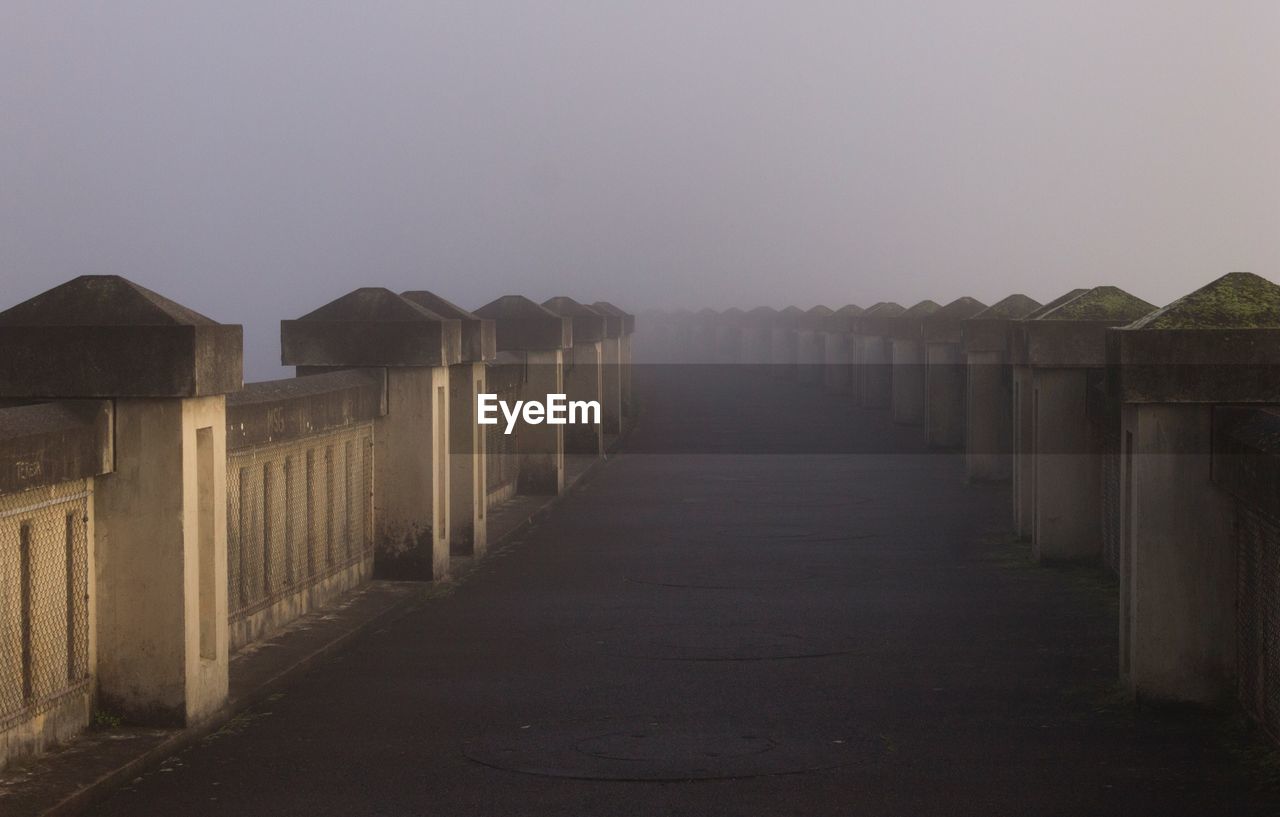 Row of built structure against clear sky