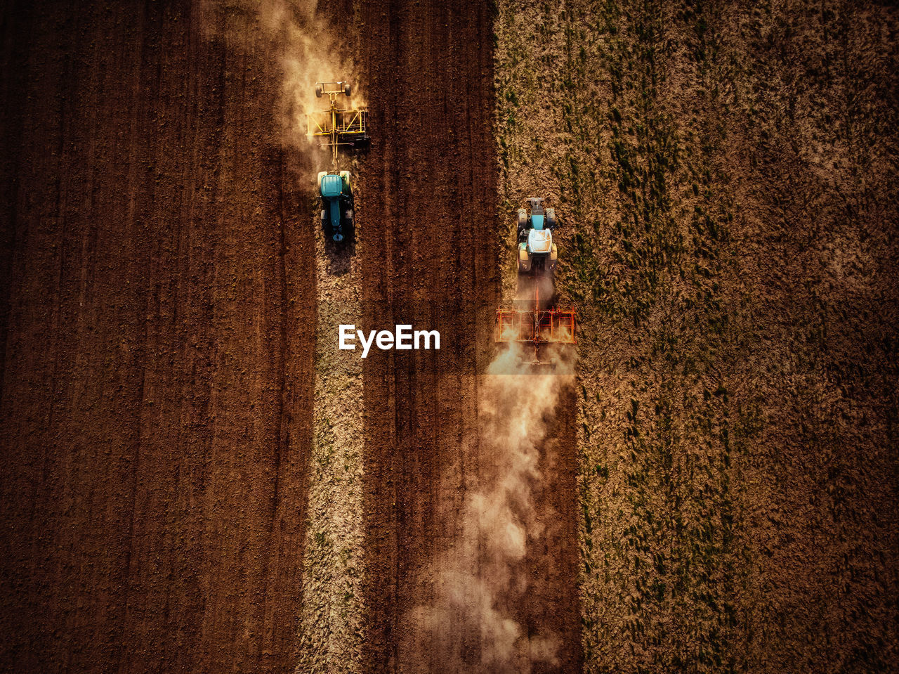 High angle view of tractors on agricultural field
