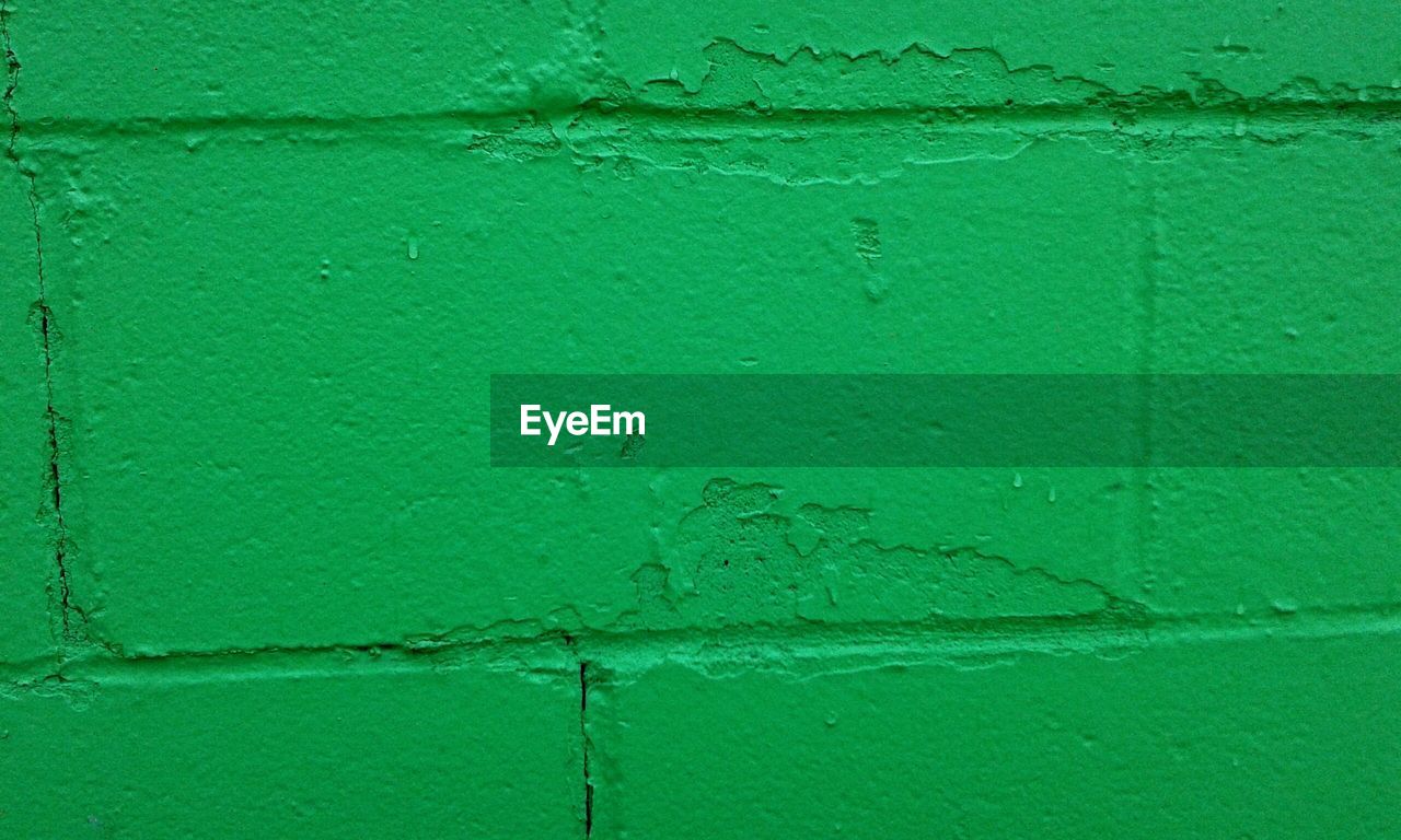 Full frame shot of green painted wall