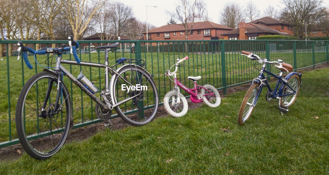 BICYCLES PARKED ON FIELD