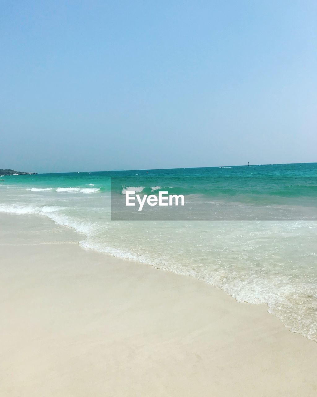 VIEW OF BEACH AGAINST CLEAR SKY