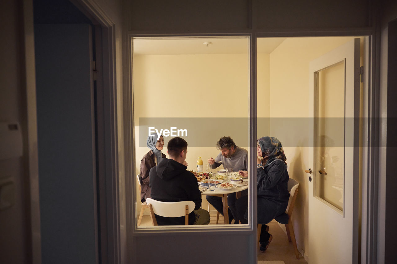 Family eating dinner together at home