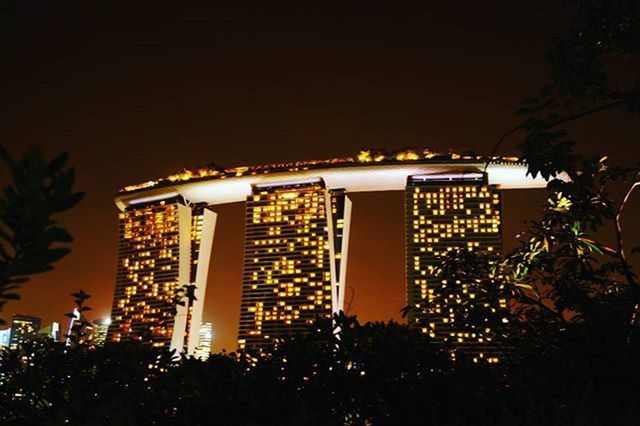 VIEW OF ILLUMINATED CITY AT NIGHT