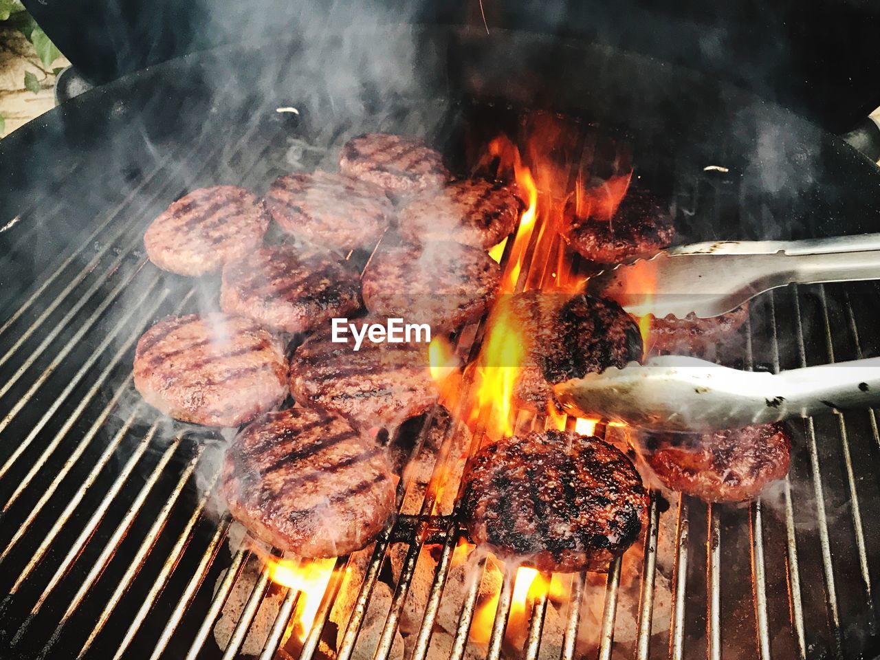 Close-up of hamburgers on barbecue grill