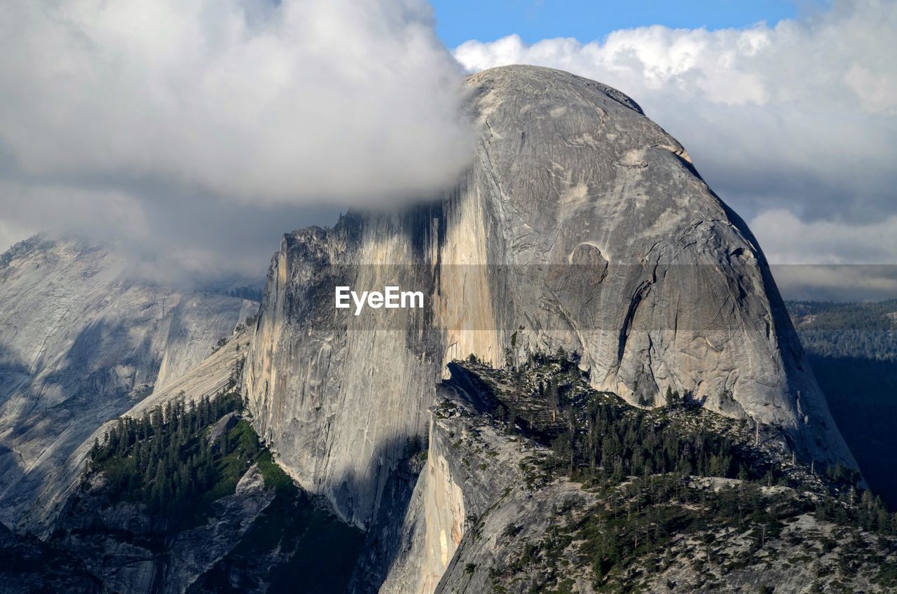 Panoramic view of rocky mountains against sky