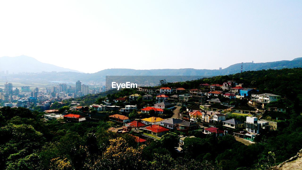 High angle shot of townscape against clear sky