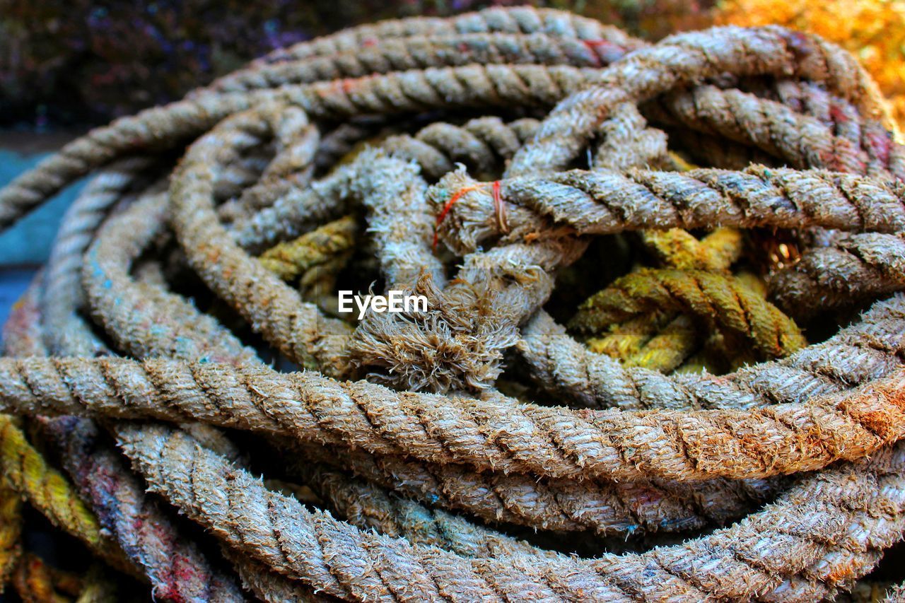 Close-up of rope tied on rusty metal