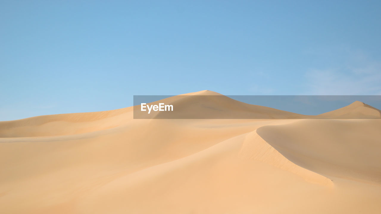 Scenic view of desert against clear sky