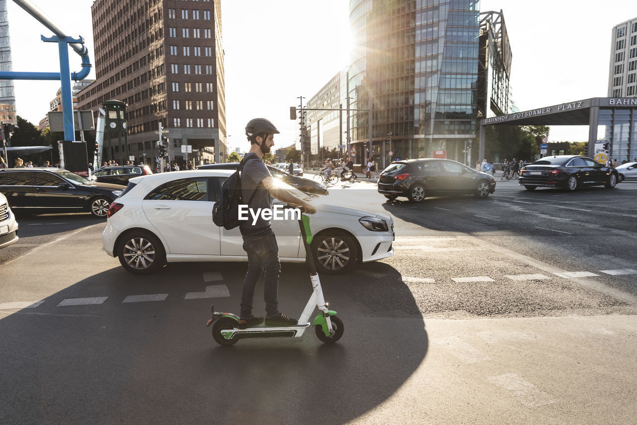 Man using e-scooter in berlin, germany