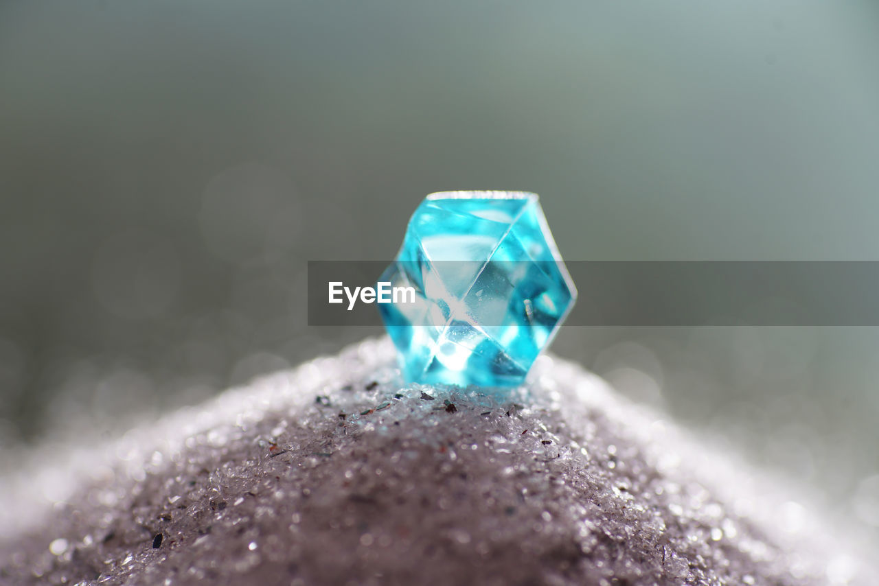 Macro shot of blue crystal on stone