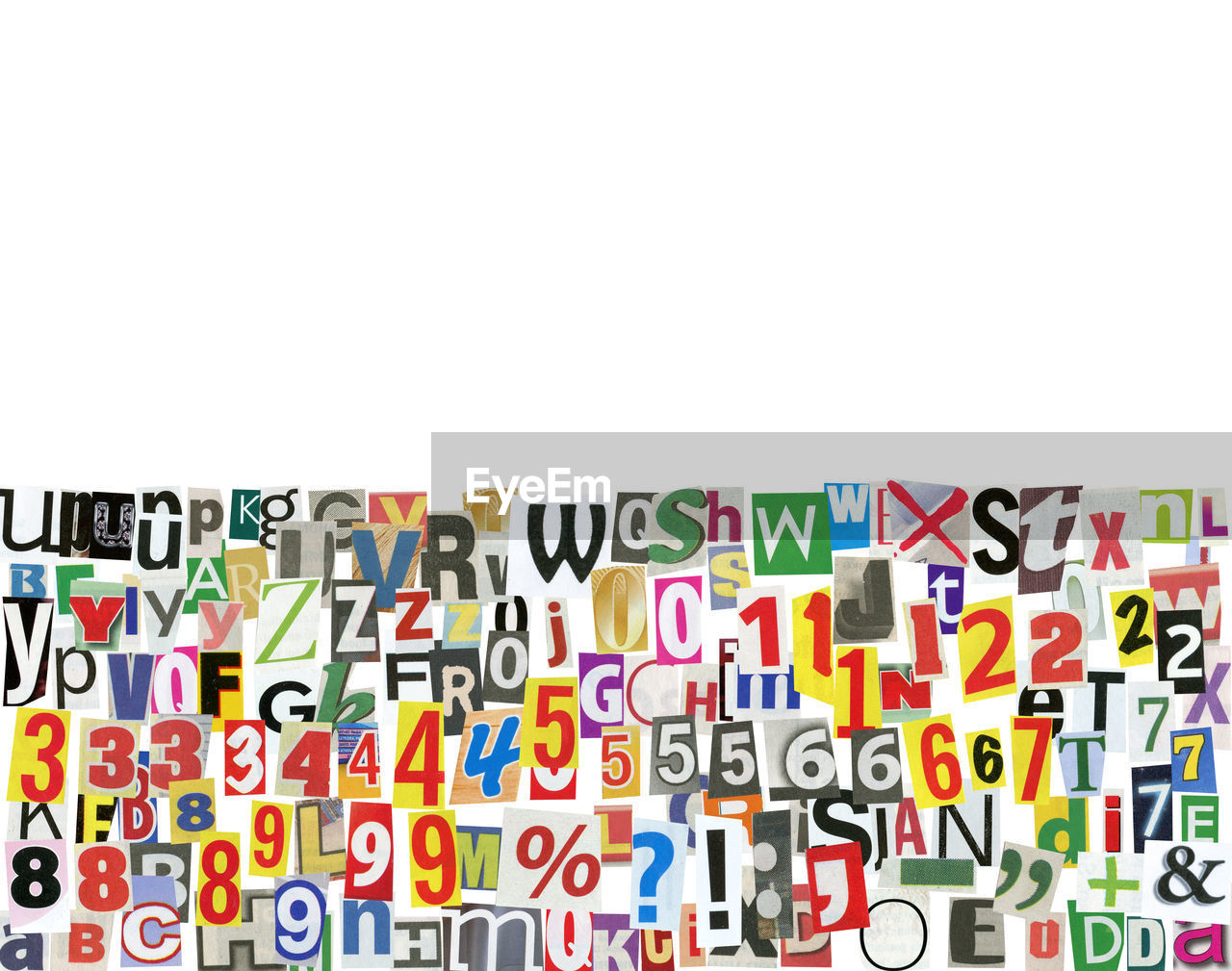 Close-up of alphabets and numbers with symbols over white background
