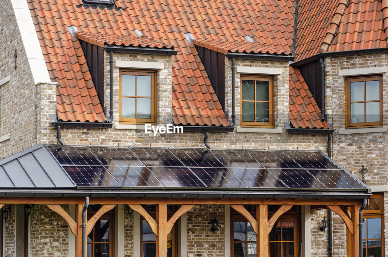 House built in traditional architecture, with solar panels as an exception