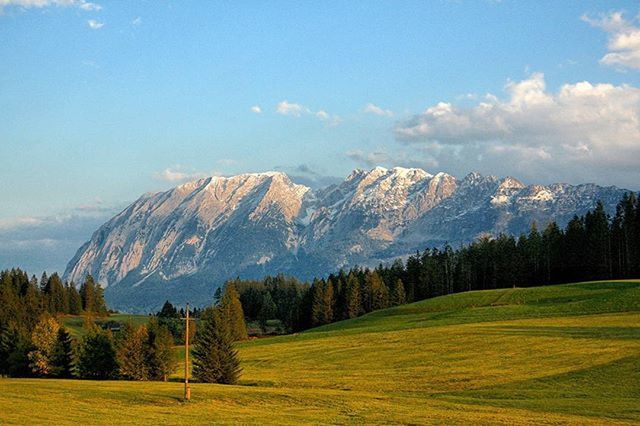 SCENIC VIEW OF MOUNTAINS AGAINST CLOUDY SKY