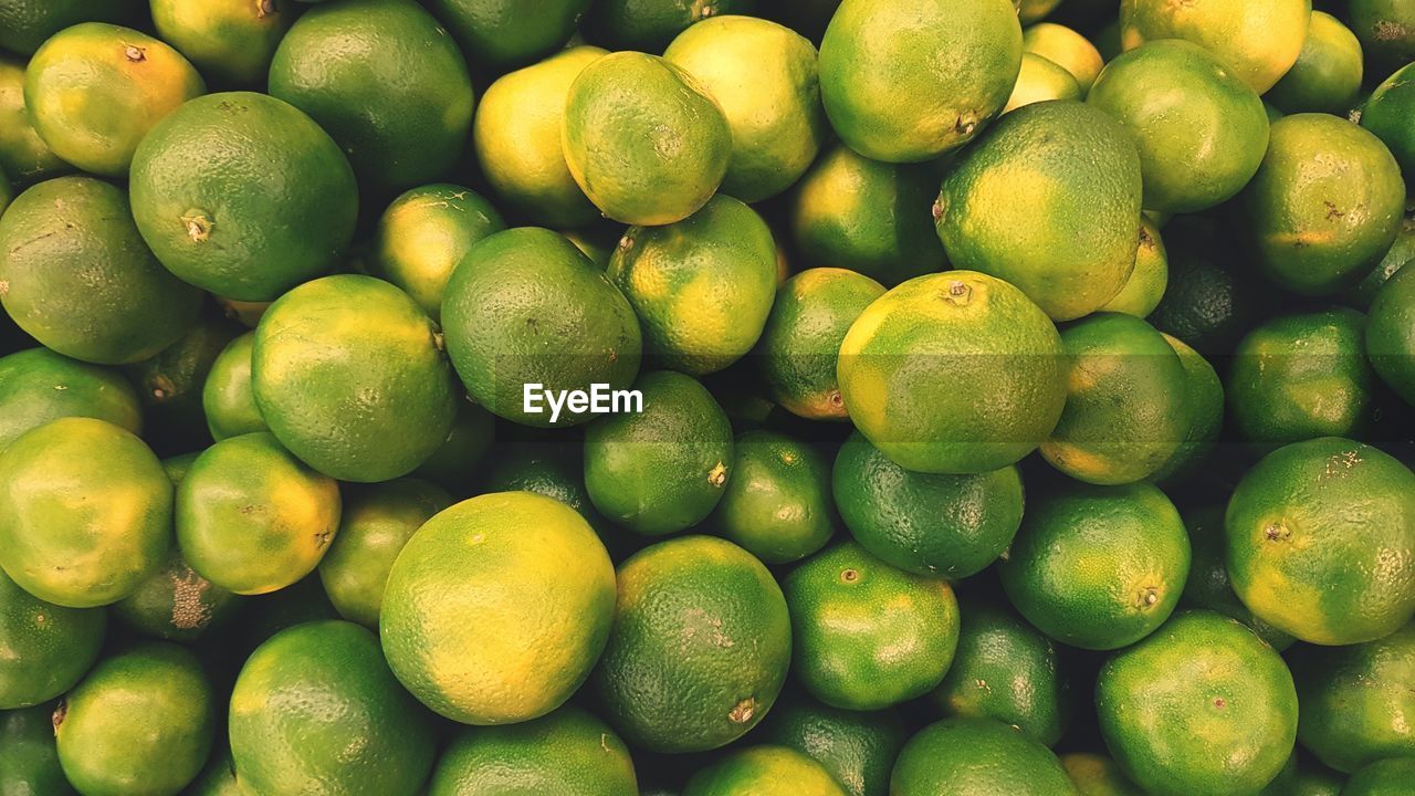 Full frame shot of lemons in market for sale