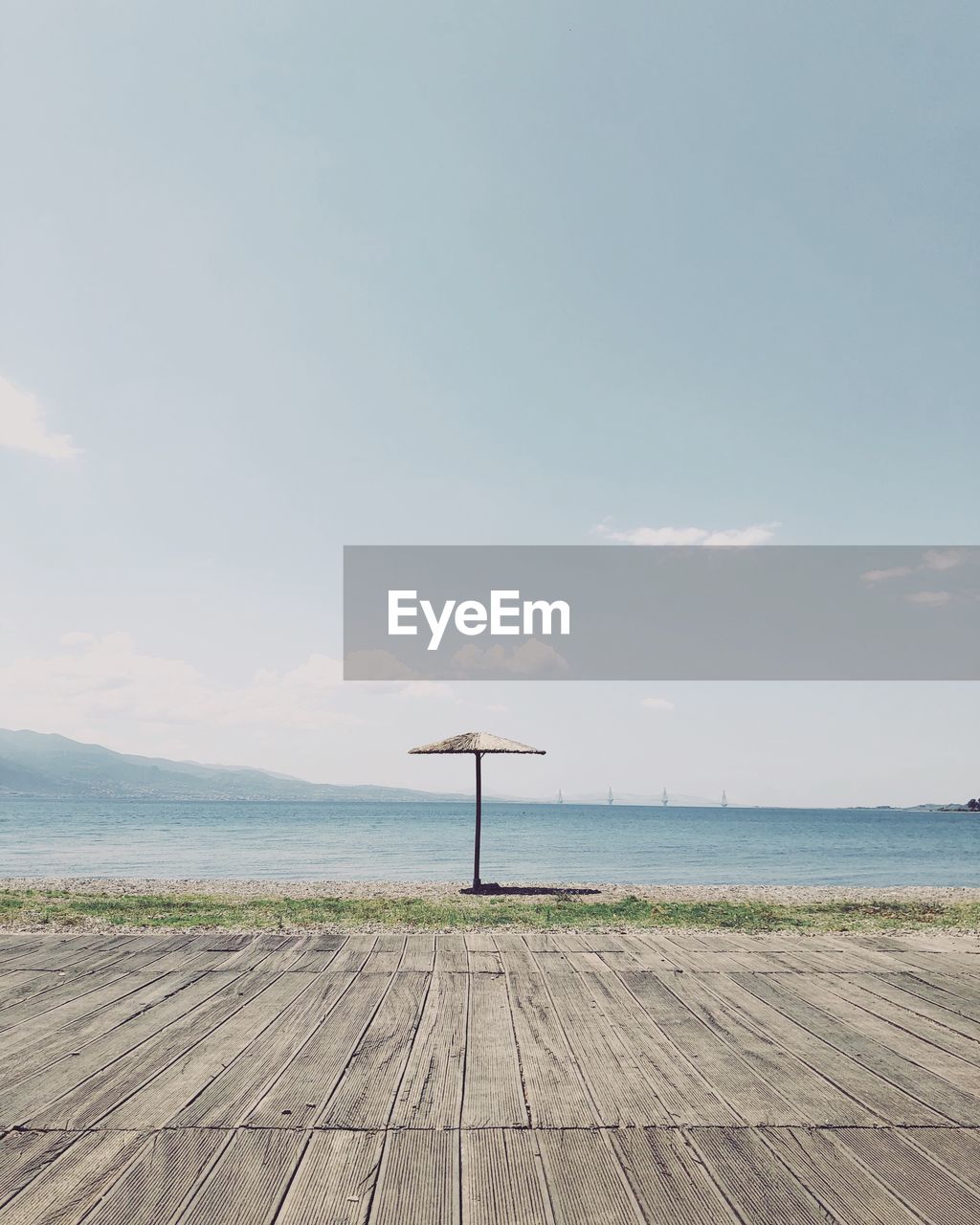 Scenic view of pier by sea against sky