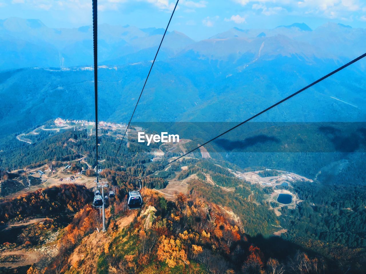 High angle view of overhead cable cars over mountains