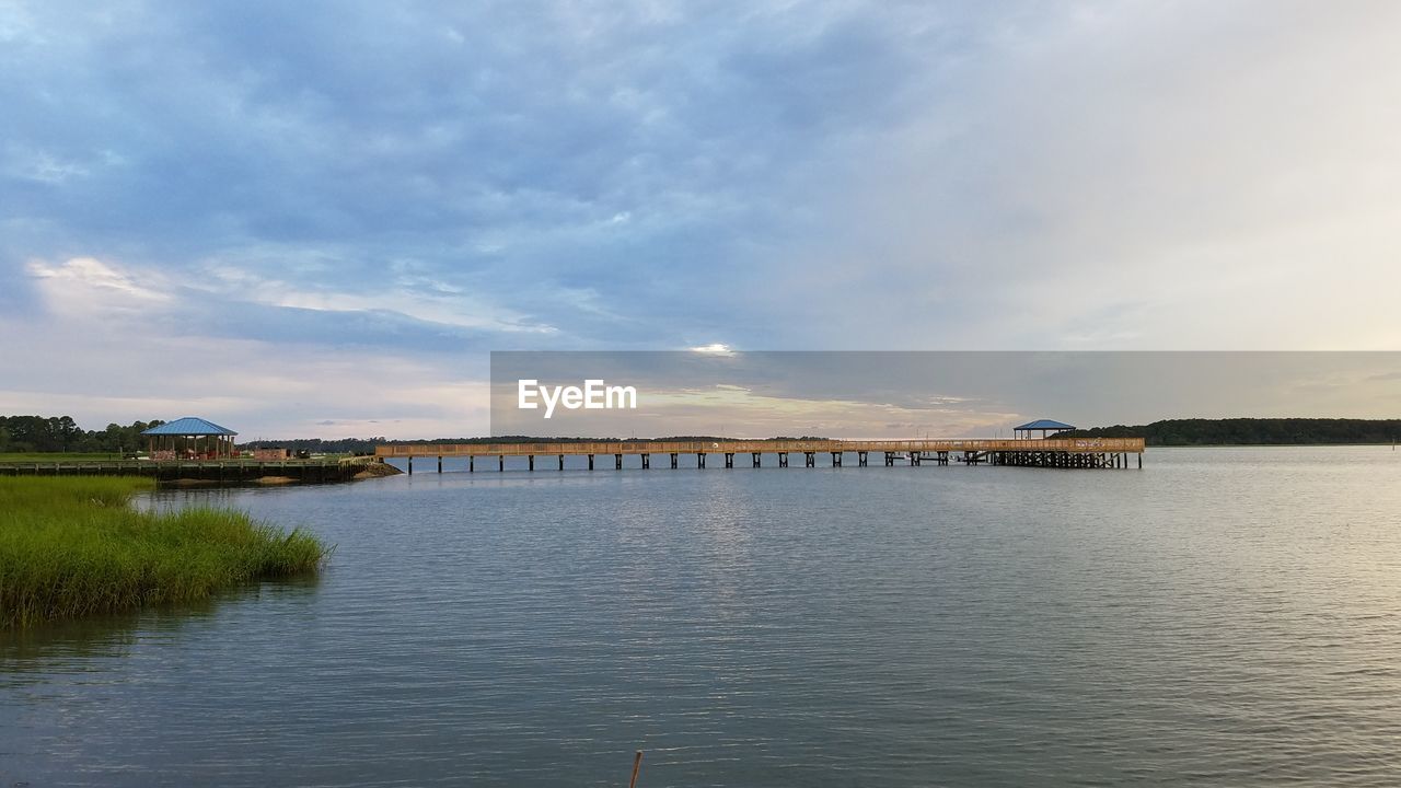 PIER OVER RIVER AGAINST SKY