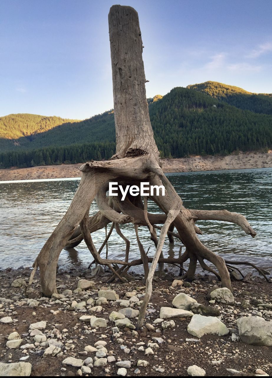 SCENIC VIEW OF LAKE WITH MOUNTAINS IN BACKGROUND