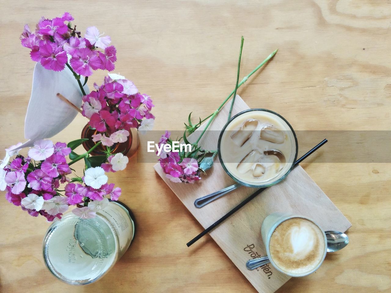 HIGH ANGLE VIEW OF VARIOUS FLOWERS IN VASE