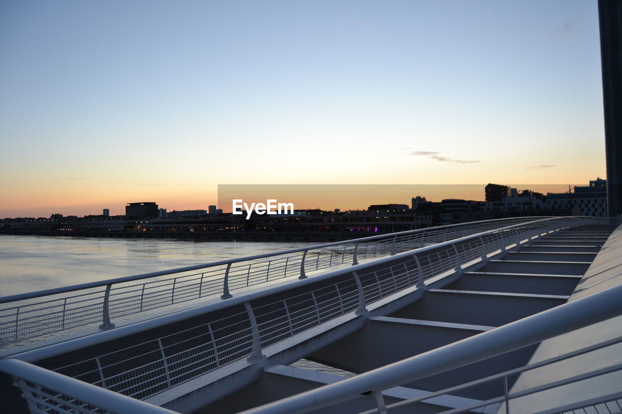 VIEW OF CITY BUILDINGS AT SUNSET