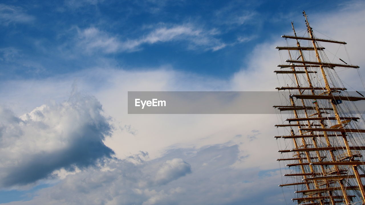 Low angle view wooden masts of sailboat