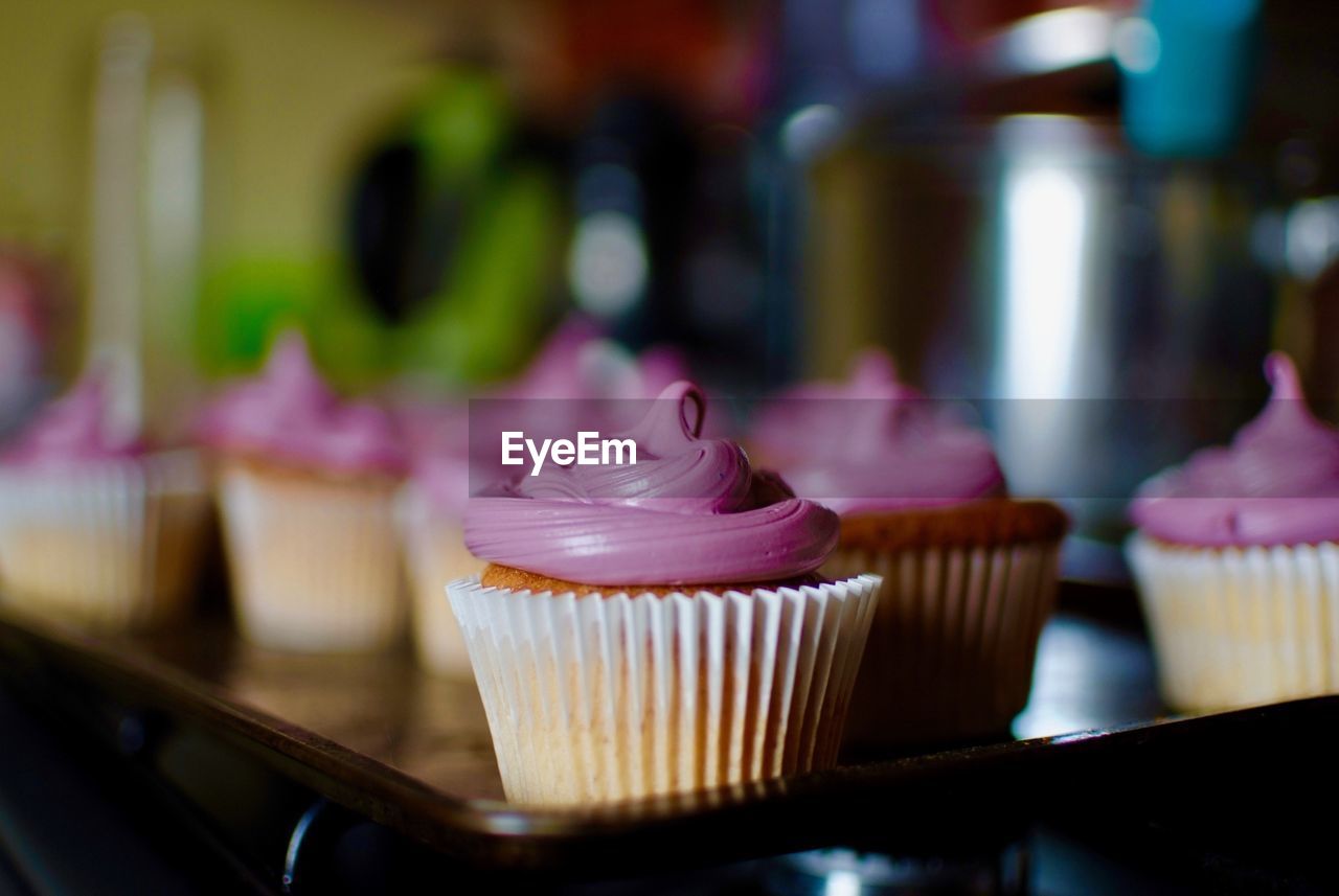 CLOSE-UP OF CUPCAKES IN CONTAINER