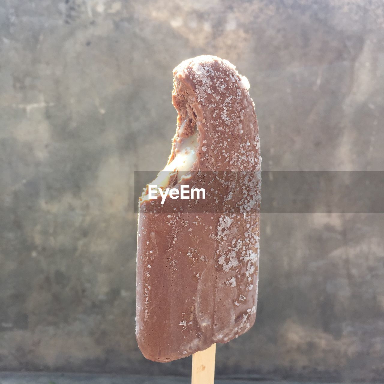 Close-up of ice cream against wall