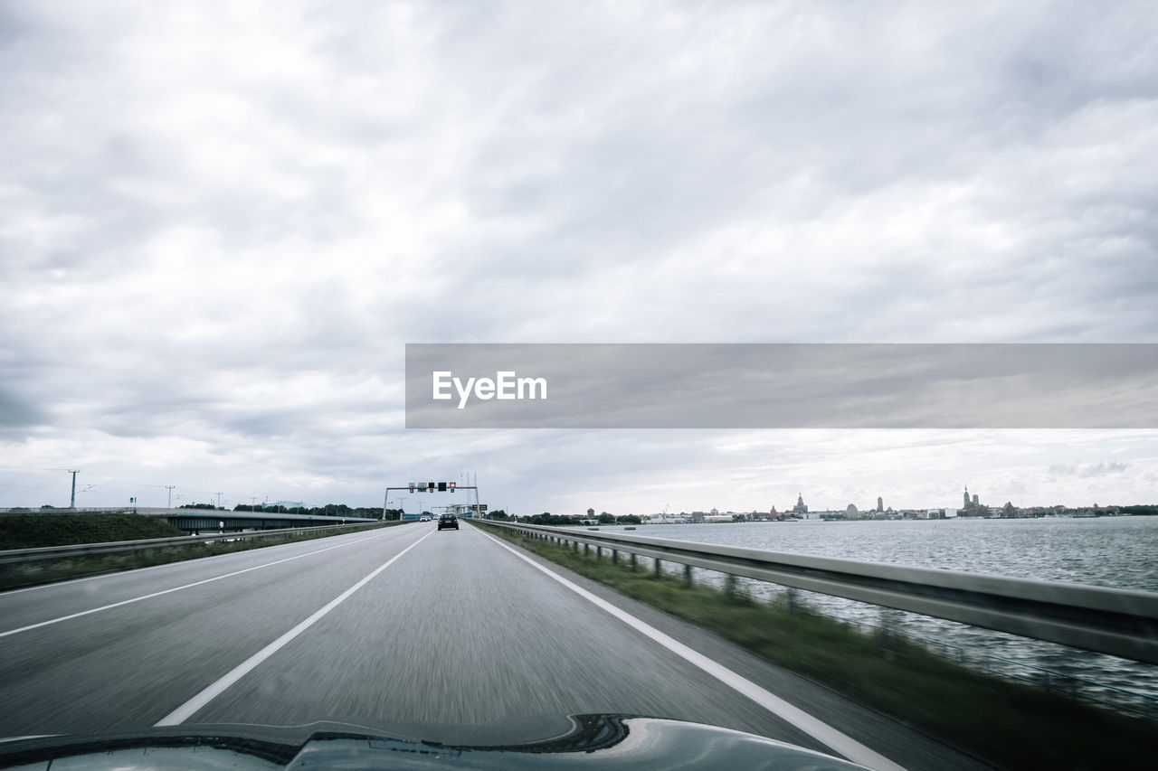 Highway seen through car windshield