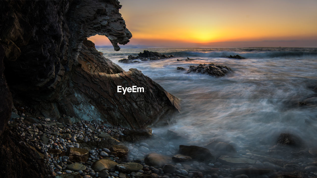 Scenic view of sea against sky during sunset